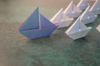 Depositphotos_202821242_l-2015_186743c0bd paper ship leading fleet